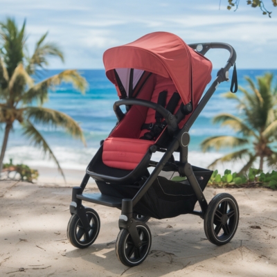 A red single stroller positioned on a sandy coastal path overlooking the ocean, with swaying palm trees and turquoise waves in the background. Designed for parents who enjoy scenic outdoor strolls.